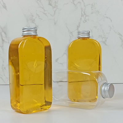 botellas de agua planas del PLA 400ml con las bebidas claras de los casquillos